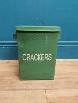 Green painted metal Crackers lidded tin. {30 cm H x 24 cm W x 18 cm D}.