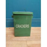 Green painted metal Crackers lidded tin. {30 cm H x 24 cm W x 18 cm D}.