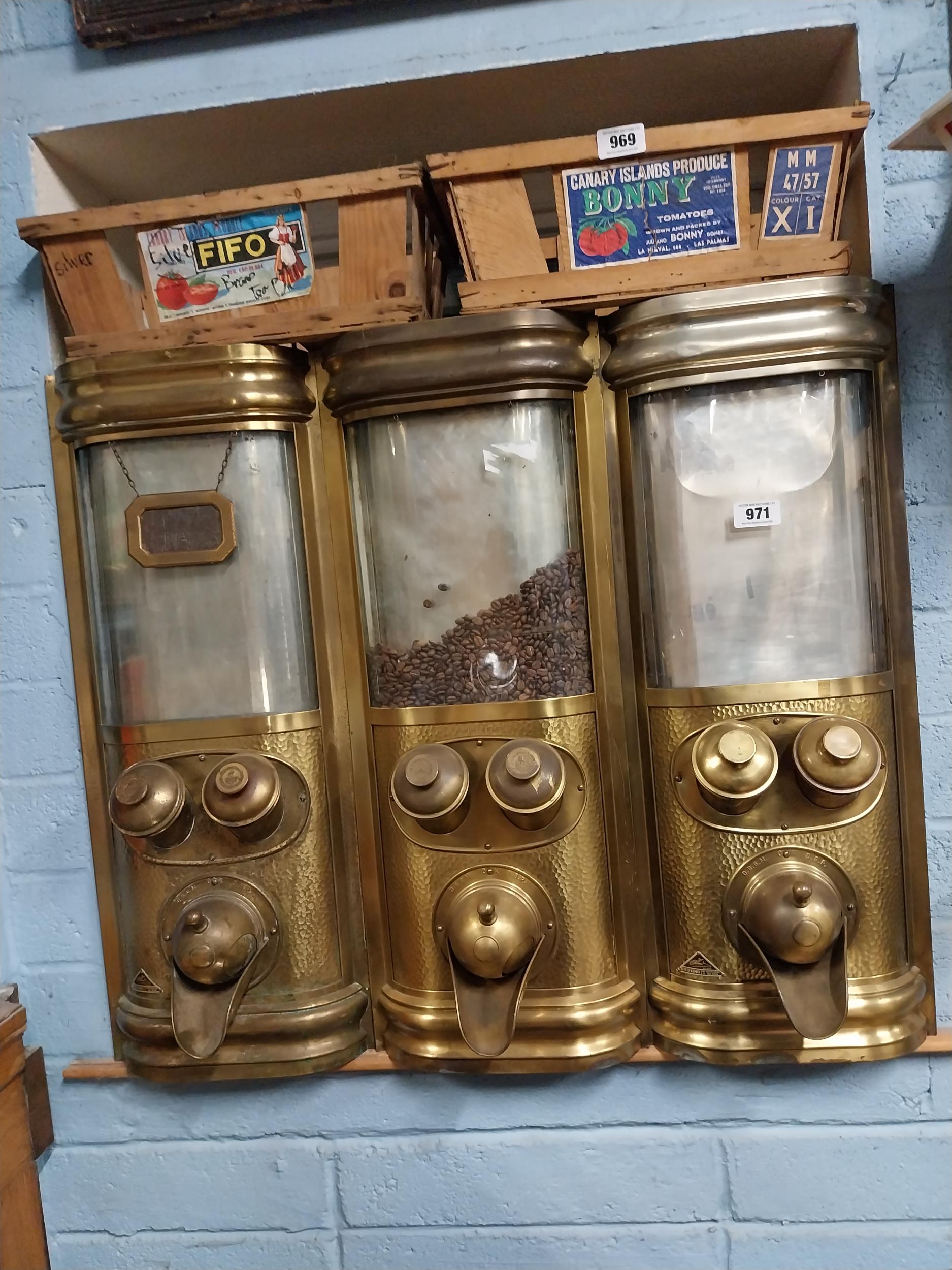 Rare set of three early 20th C. Otto Kind brass coffee dispensers. {80 cm H x 96 cm W x 35 cm D}.