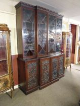 Edwardian mahogany bookcase four astral glazed doors above four carved blind doors in the Adams
