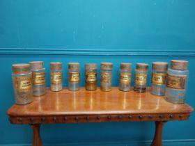 Set of ten early 20th C. glass chemist's jars with original labels.