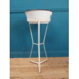 Edwardian enamel basin on wrought iron tripod stand. {90 cm H x 40 cm Dia. }.