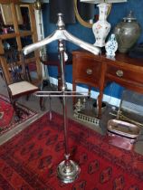 Chrome valet stand {140 cm H x 48 cm W x 27 cm D}.