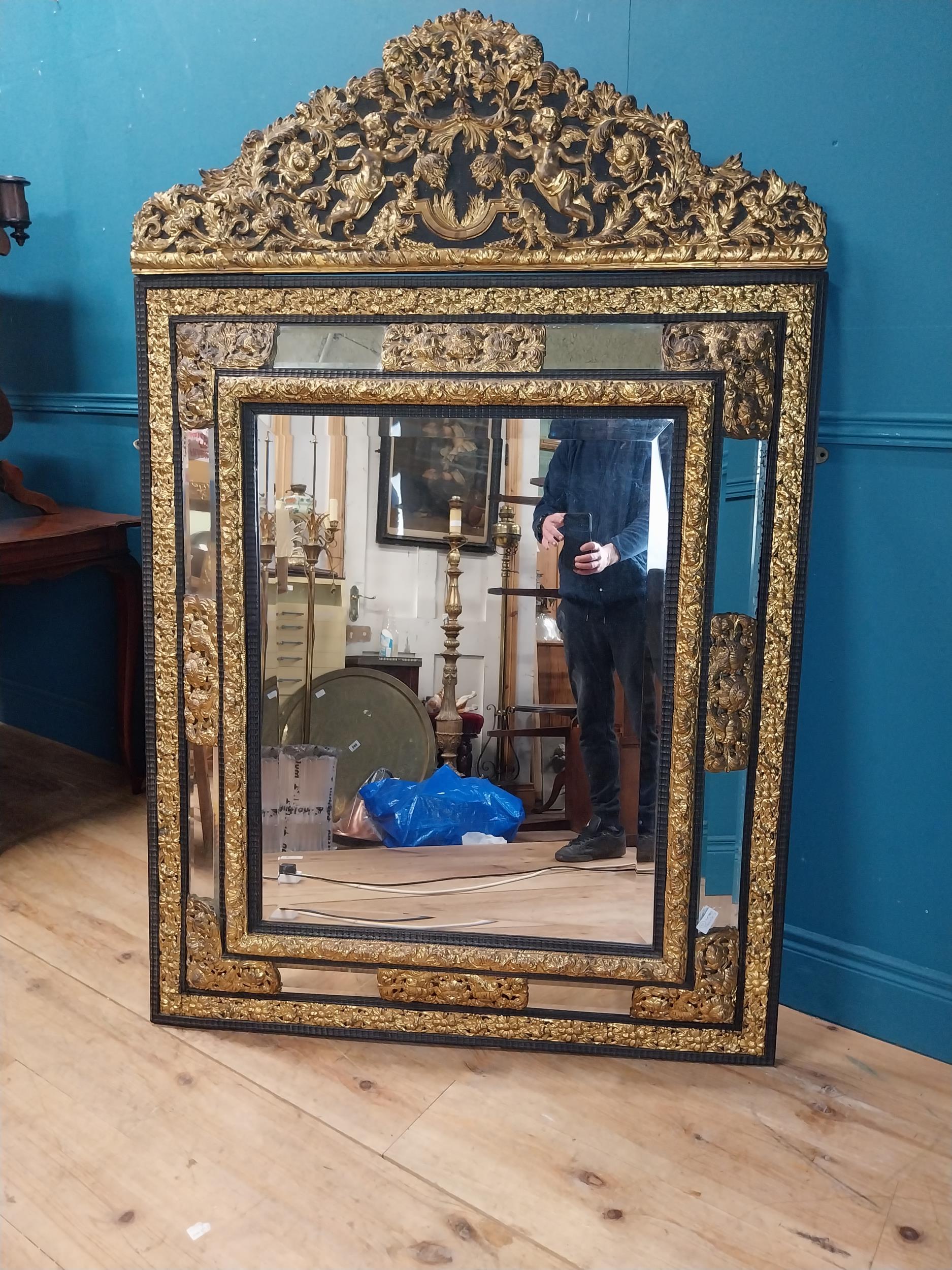 19th C. French brass and ebonised cushion mirror surmounted with cherub and flora and foliage - Image 8 of 8