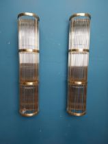 Pair of Ralph Lauren Allen Linear brass and glass wall sconces. {70 cm H x 15 cm W x 12 cm D}.