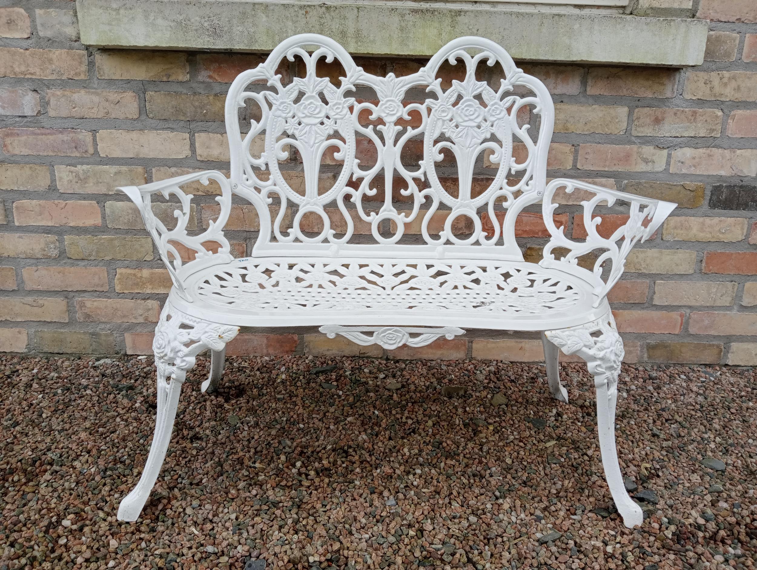 Cast aluminium two seater garden bench {H 84cm x W 100cm x D 50cm }.