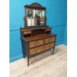 Edwardian walnut and mahogany dressing table raised on turned legs and castors {170 cm H x 117 cm