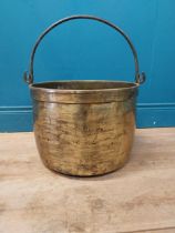 Early 20th C. brass log bucket with wrought iron handle {52 cm H x 47 cm Dia.}.