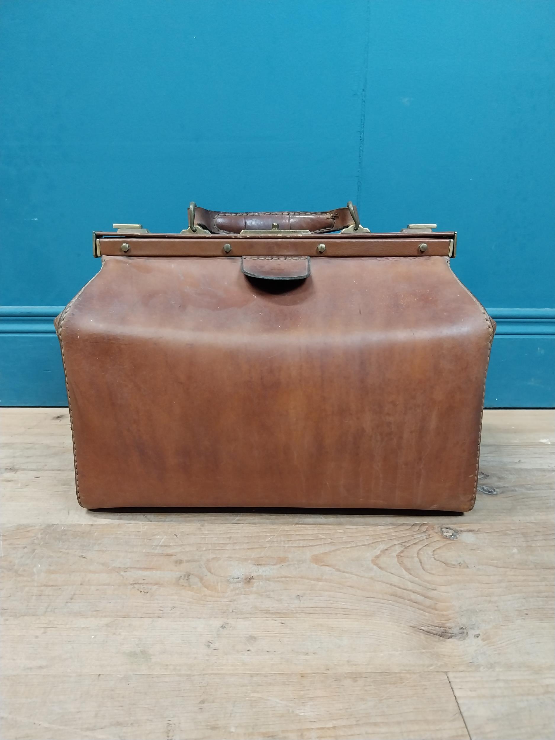 Early 20th C. leather Gladstone bag with metal mounts stamped Marque Deposee. {36 cm H x 41 cm W x