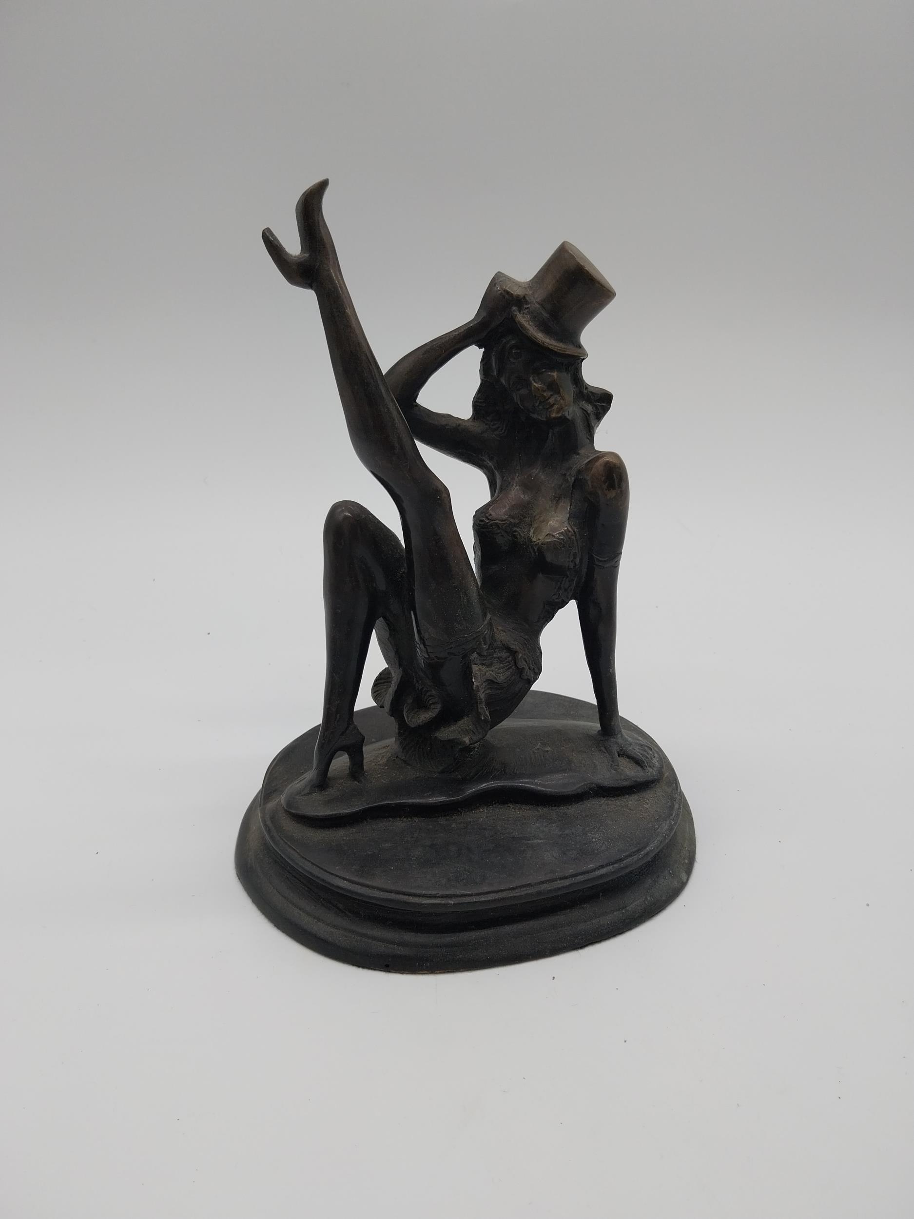 Bronze model of a Dancer with Top Hat. {23 cm H x 19 cm W x 14 cm D}.