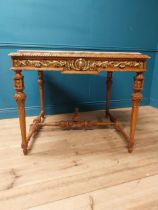 Walnut and partial gilt centre table with marble top raised on carved turned legs {87 cm H x 104