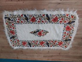 Decorative woollen rug decorated with birds.