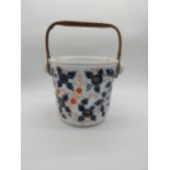 19th C. ceramic pot with wicker handle. {37 cm H x 32 cm W x 26 cm D}.