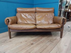 Mid Century rosewood and leather two seater sofa {83 cm H x 140 cm W x 90 cm D}.