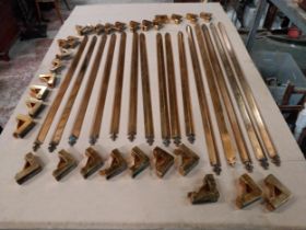 Fifteen exceptional quality bronze stair rods with brackets {10 - 93 cm L and 5 - 115 cm L}.