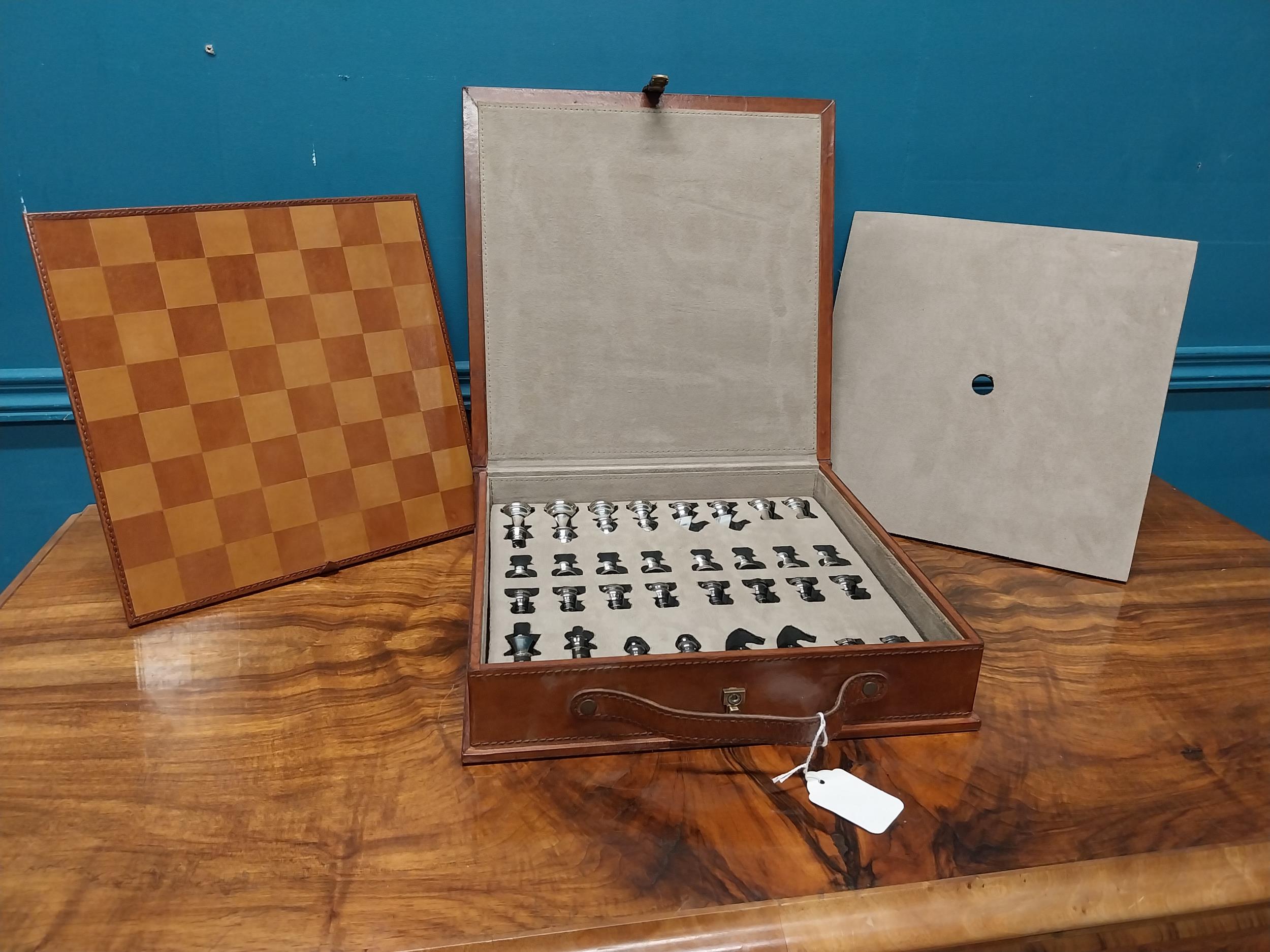 Cased leather chess set.