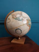 World Globe on wooden stand. {45 cm H x 33 cm Dia.}.