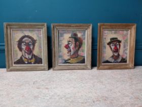 Set of three early 20th C. Clown oil on boards mounted in wooden frames {35 cm H x 30 cm W}.