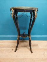 19th C. French ebonised jardiniere stand with brass gallery and fox head mounts and chain detail. {