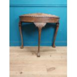 1950's mahogany demi lune table with carved frieze on the claw and ball feet. {83 cm H x 90 cm W x