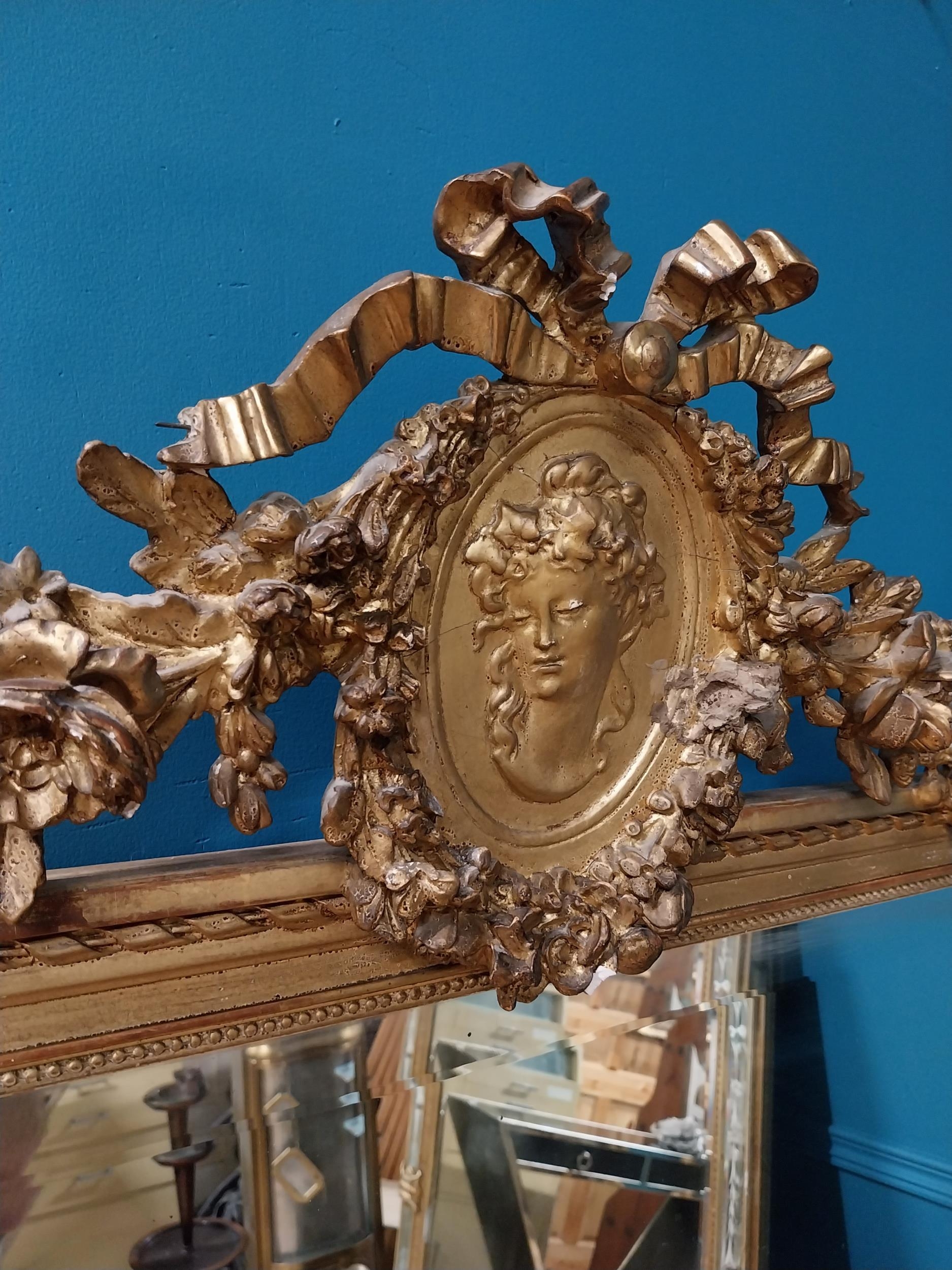 19th C. French gilt mirror with floral decoration surmounted with female mask and bows. {168 cm H - Image 9 of 10