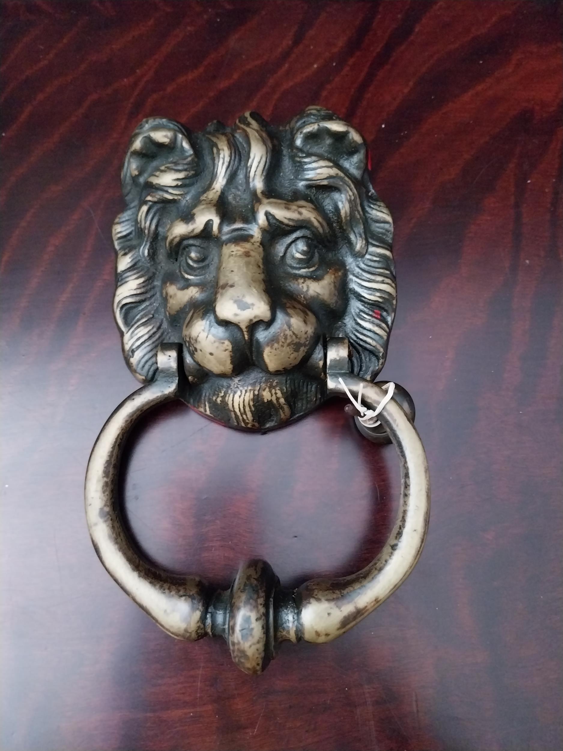 19th C. lions mask door knocker {20 cm H}.