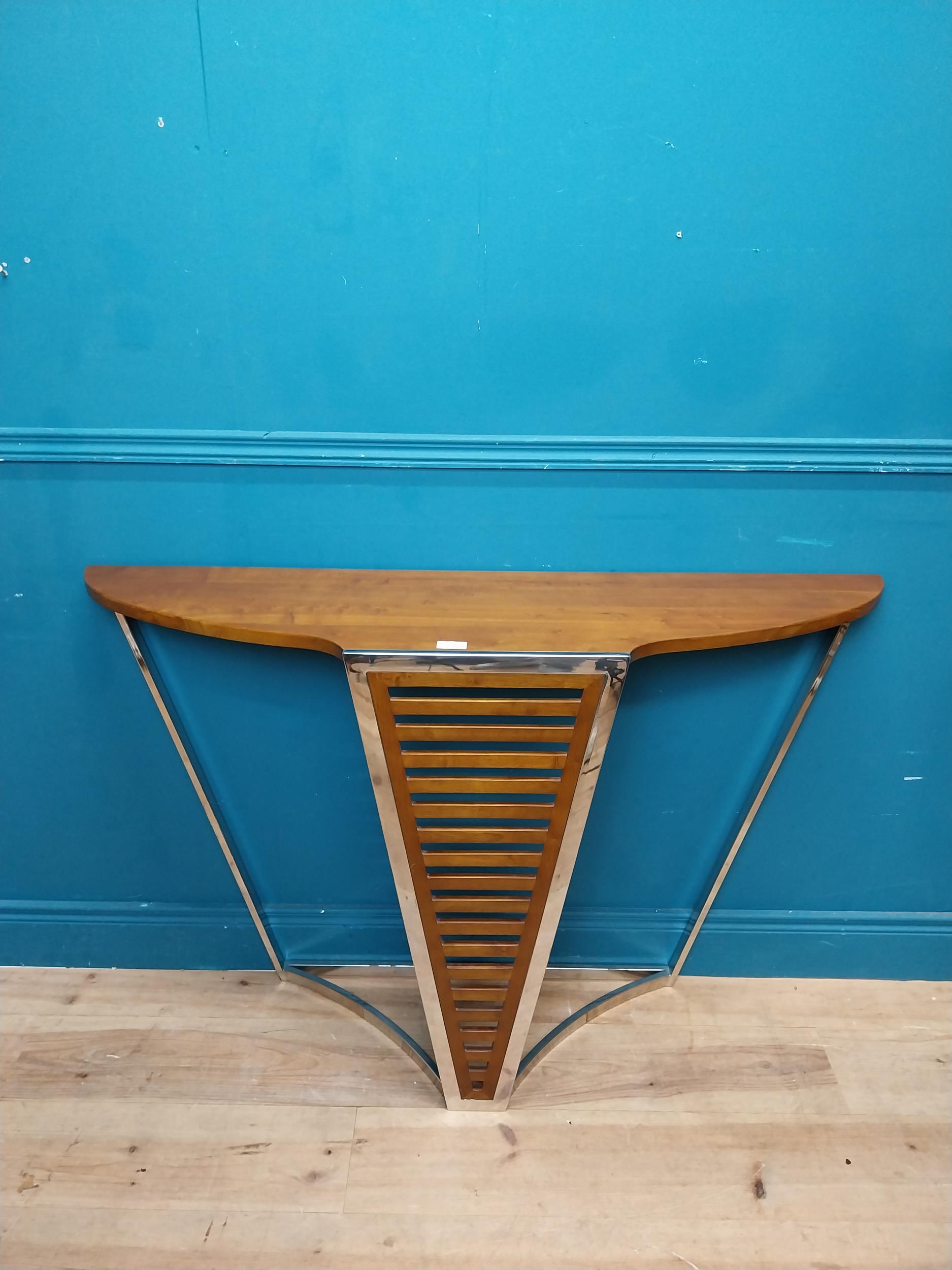 Exceptional quality chrome and walnut console table in the Art Deco style {}.