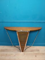 Exceptional quality chrome and walnut console table in the Art Deco style {}.