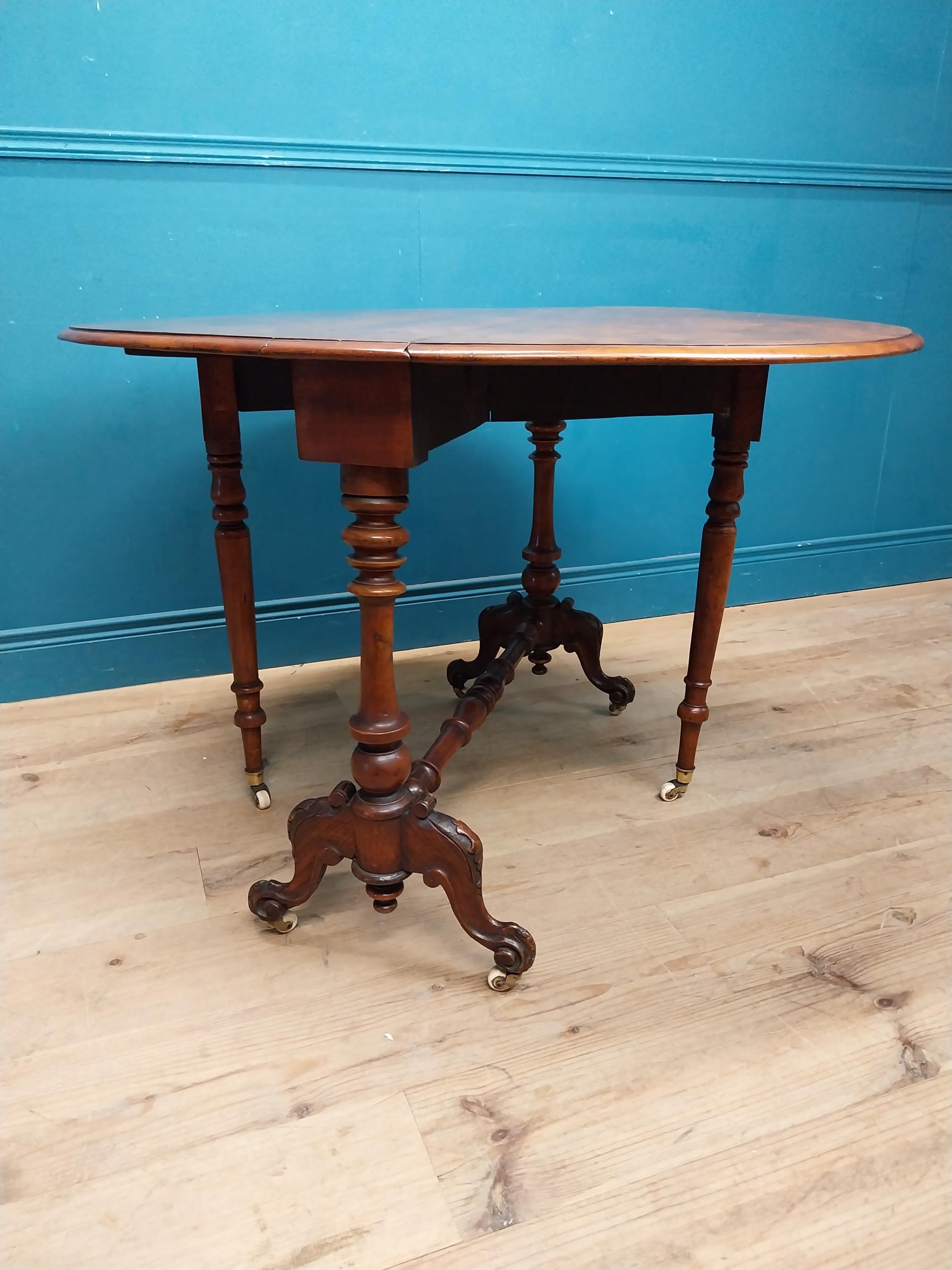 19th C. burr walnut Sutherland table with turned legs raised on arched feet with castors. {73 cm H x - Image 5 of 7