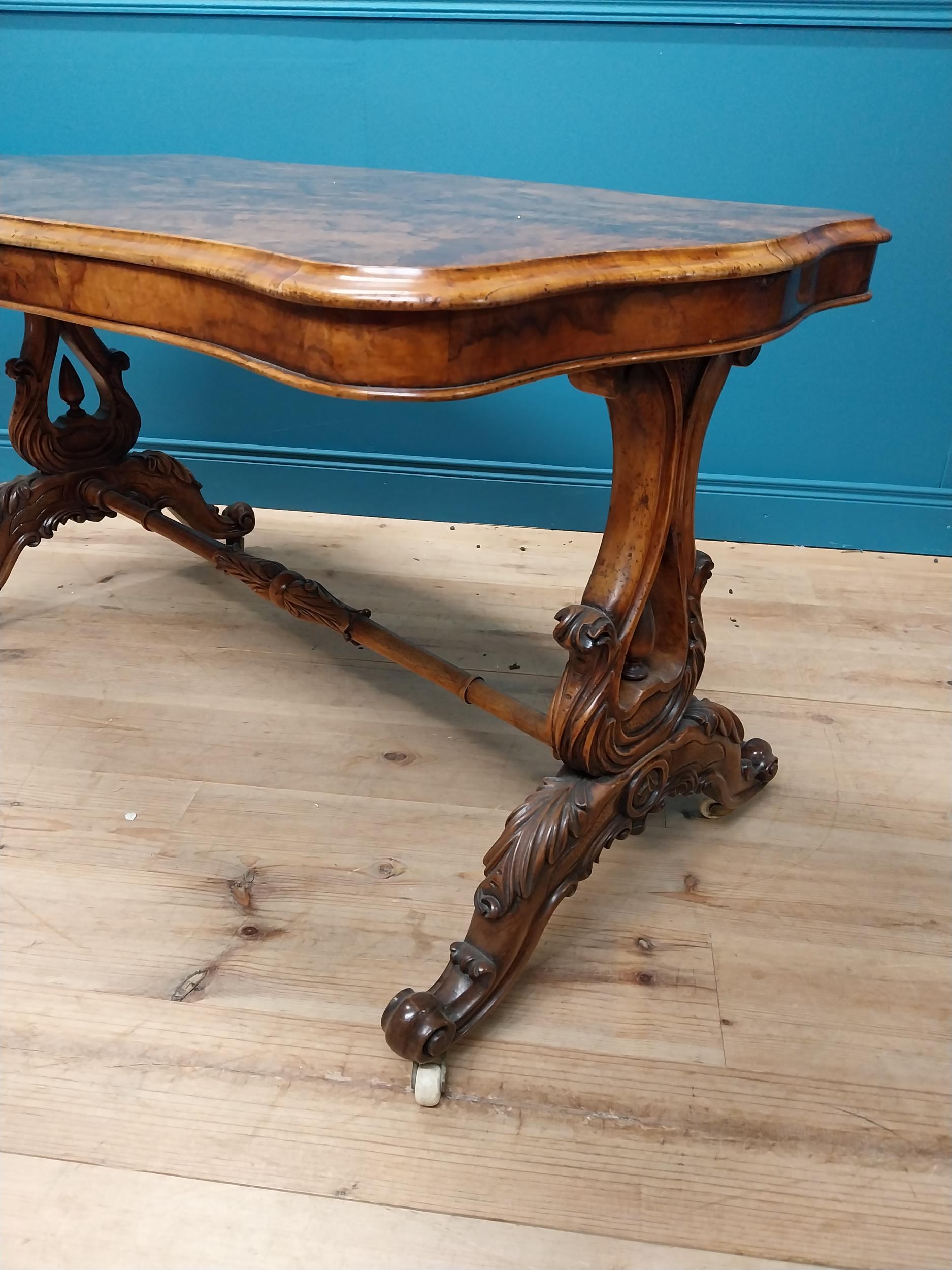 19th C. burr walnut sofa table raised on lyre supports and four outswept legs on turned stretcher { - Image 4 of 5