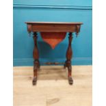 19th C. rosewood work table with fitted interior raised on shaped carved legs with single turned