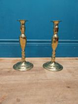 Pair of brass candle sticks {27 cm H x 13 cm Dia.}.