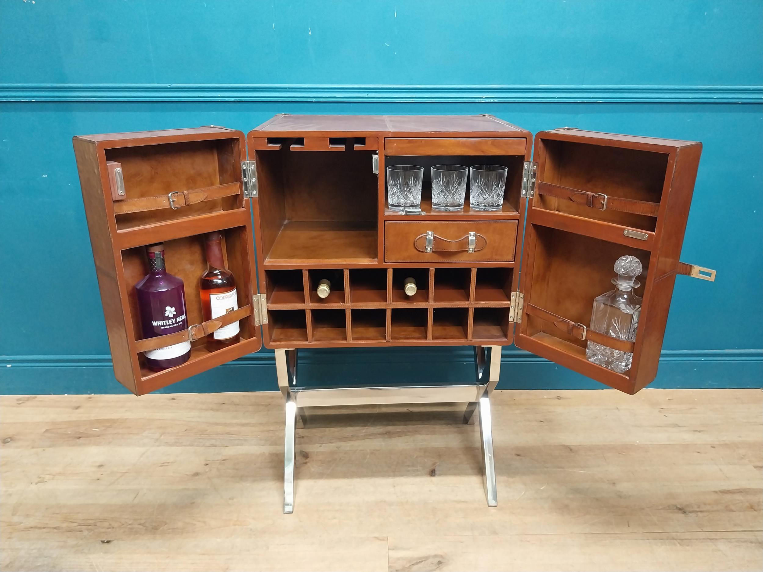 Leather and chrome bar the two doors enclosing shelves pigeon holes and a drawer, raised on X - - Image 2 of 12