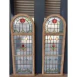 Pair of reclaimed arch topped stained glass windows {Each H 191cm x W 67cm x D 9cm}.