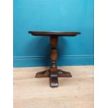 Oak wine table on turned column with four outswept shaped feet. {45 cm H x 45 cm Dia.}.