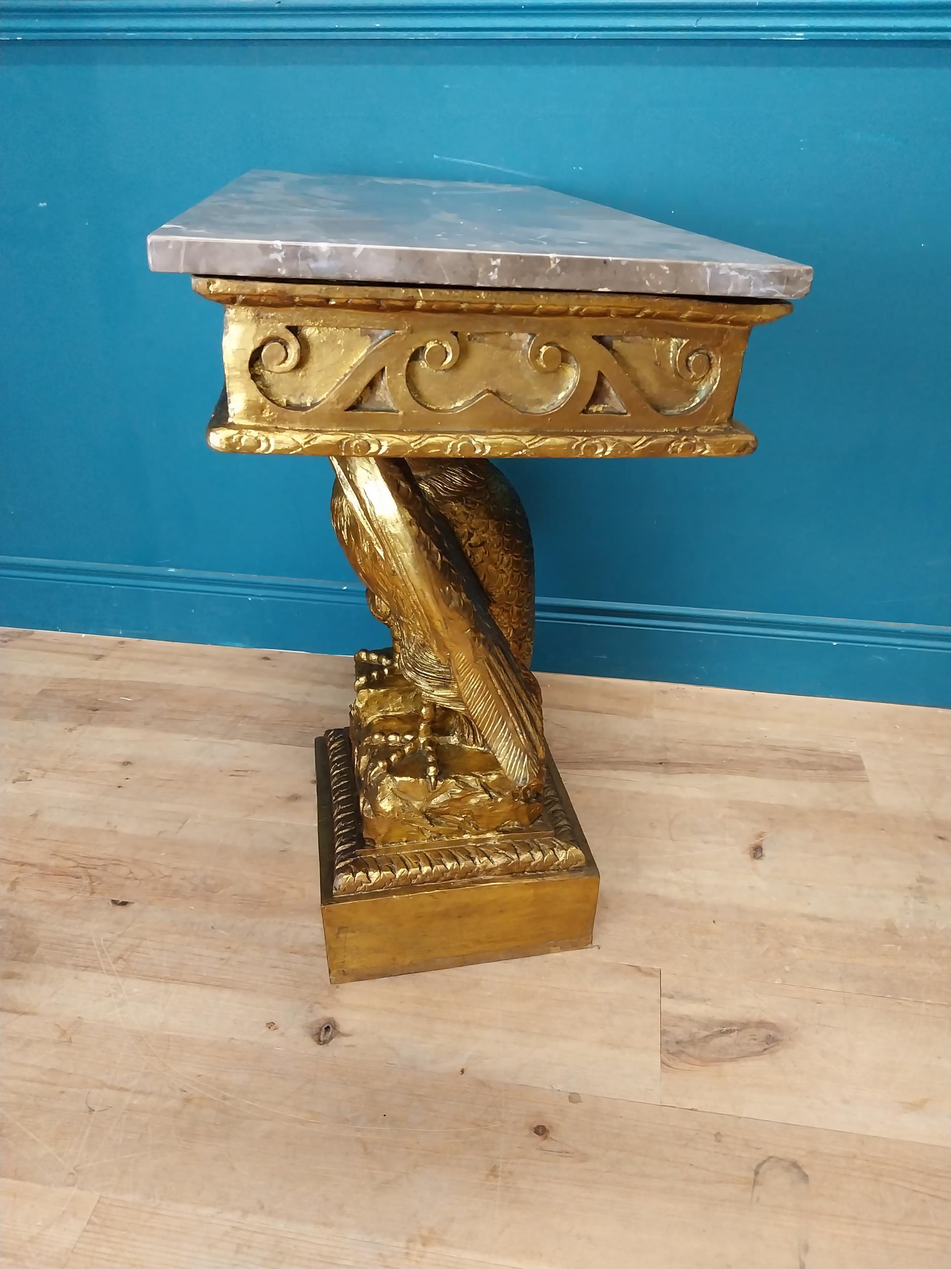 Pair of gilt cast metal marble topped console tables with outspread eagles on base in the William - Image 8 of 8