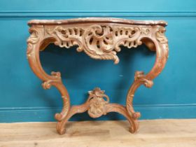 19th C. ornate gilded wood console table with marble top. {87 cm H x 114 cm W x 43 cm D}.