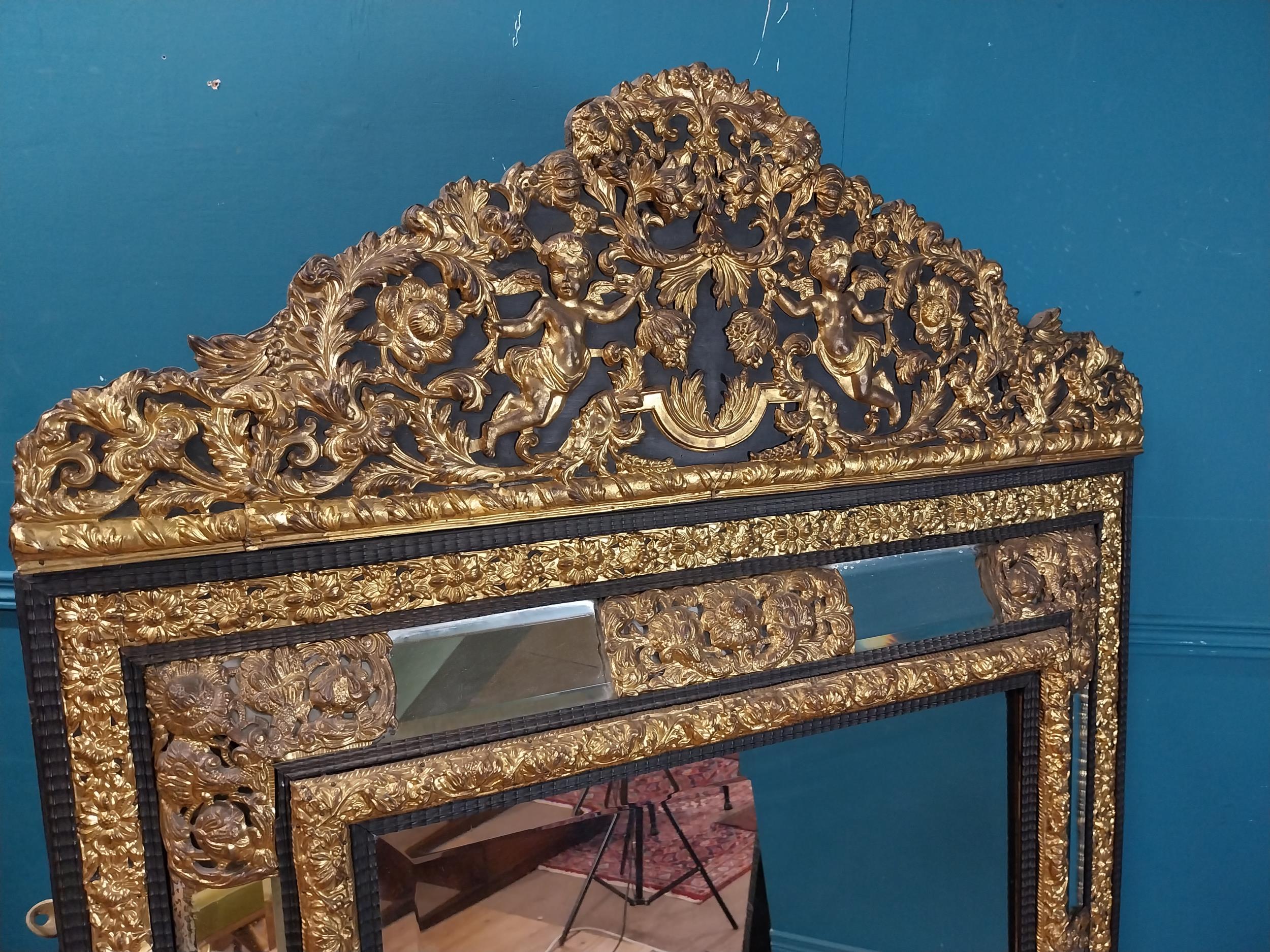 19th C. French brass and ebonised cushion mirror surmounted with cherub and flora and foliage - Image 4 of 8