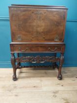 Edwardian burr walnut cocktail cabinet with fitted interior and single drawer raised carved legs {