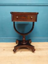 William IV rosewood lamp table with single drawer in frieze raised on bow shaped support on platform