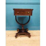 William IV rosewood lamp table with single drawer in frieze raised on bow shaped support on platform