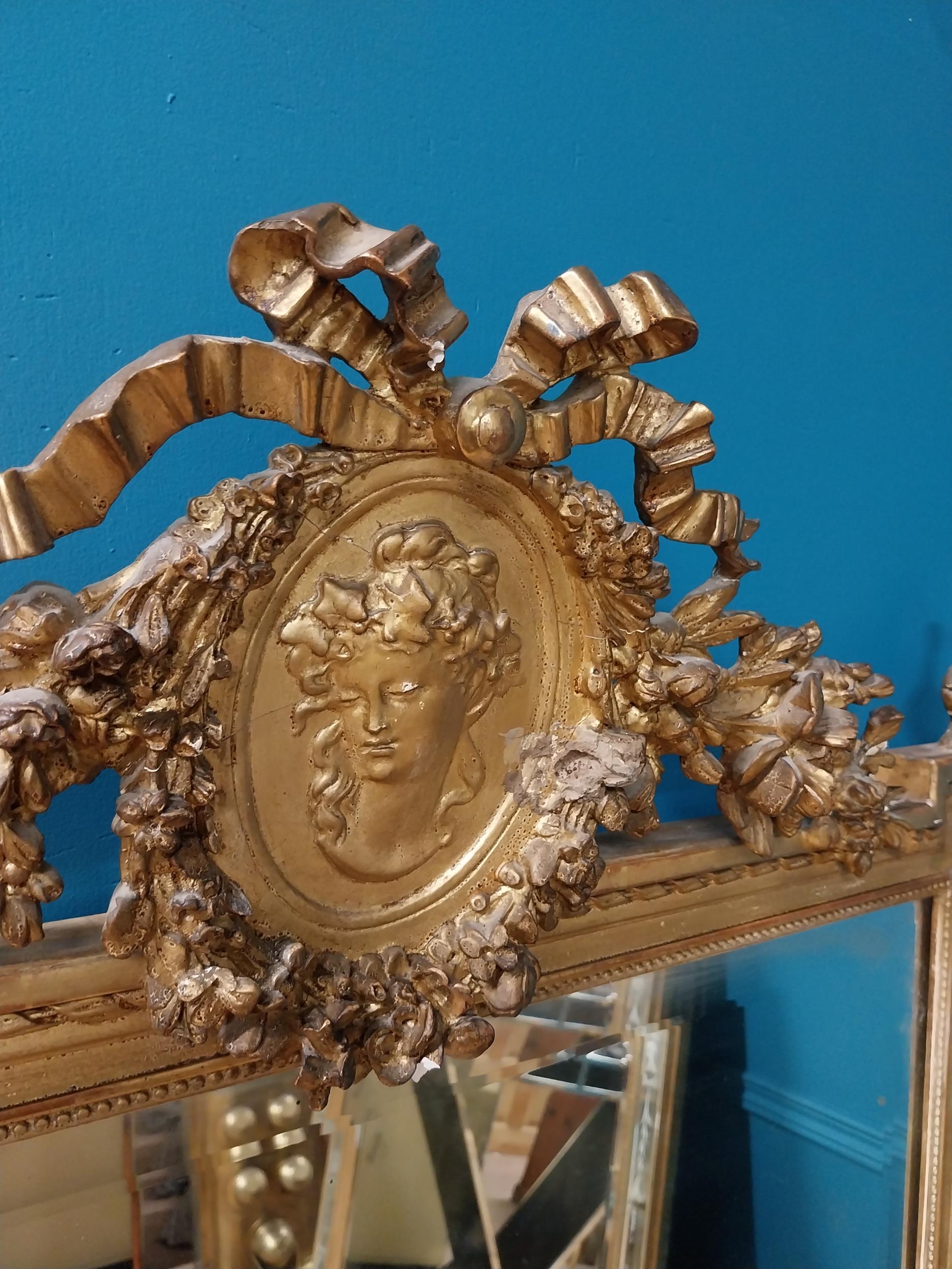 19th C. French gilt mirror with floral decoration surmounted with female mask and bows. {168 cm H - Image 3 of 10