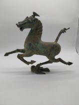 Bronze model of Flying Horse of Gansu. {35 cm H x 44 cm W x 12 cm D}.