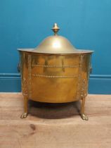 Edwardian brass decorative lidded coal bucket on three claw feet. {47 cm H x 40 cm W x 31 cm D}.