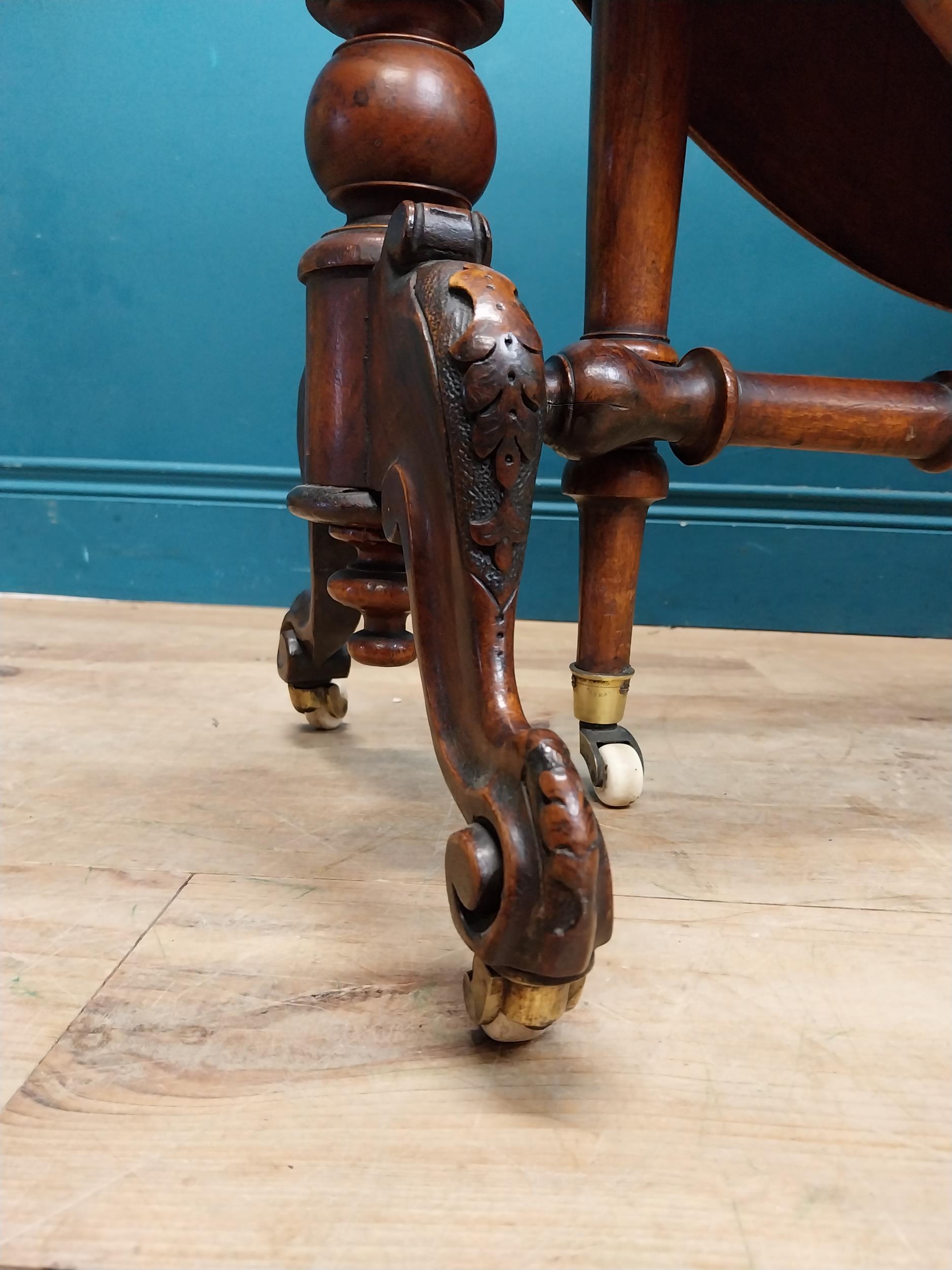 19th C. burr walnut Sutherland table with turned legs raised on arched feet with castors. {73 cm H x - Image 3 of 7