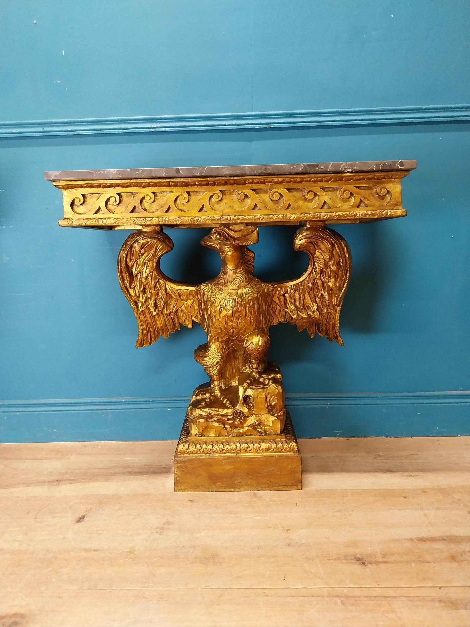 Pair of gilt cast metal marble topped console tables with outspread eagles on base in the William - Image 2 of 8