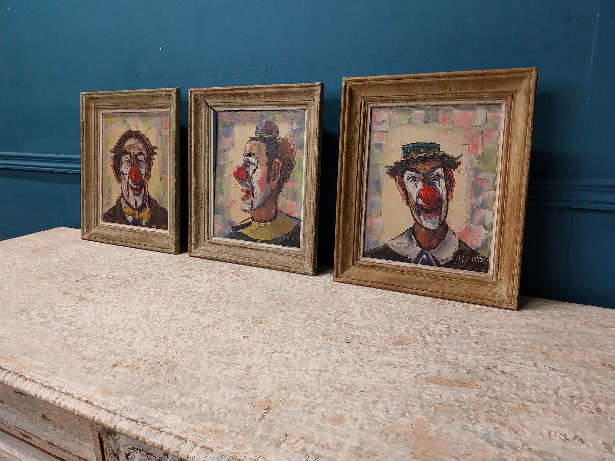 Set of three early 20th C. Clown oil on boards mounted in wooden frames {35 cm H x 30 cm W}. - Image 3 of 8