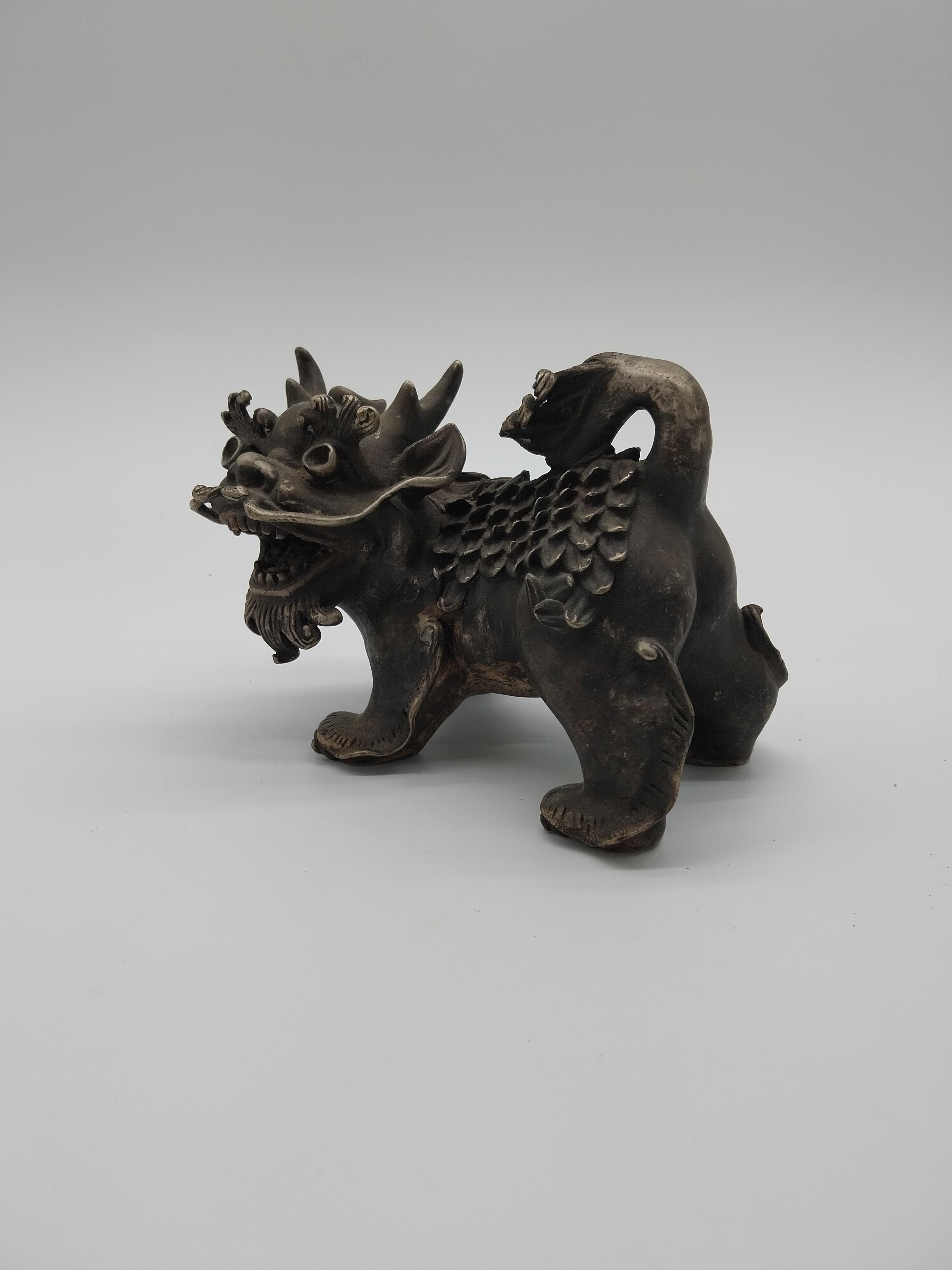 White metal Chinese Dog of Fu. {24 cm H x 19 cm W x 12 cm D}.