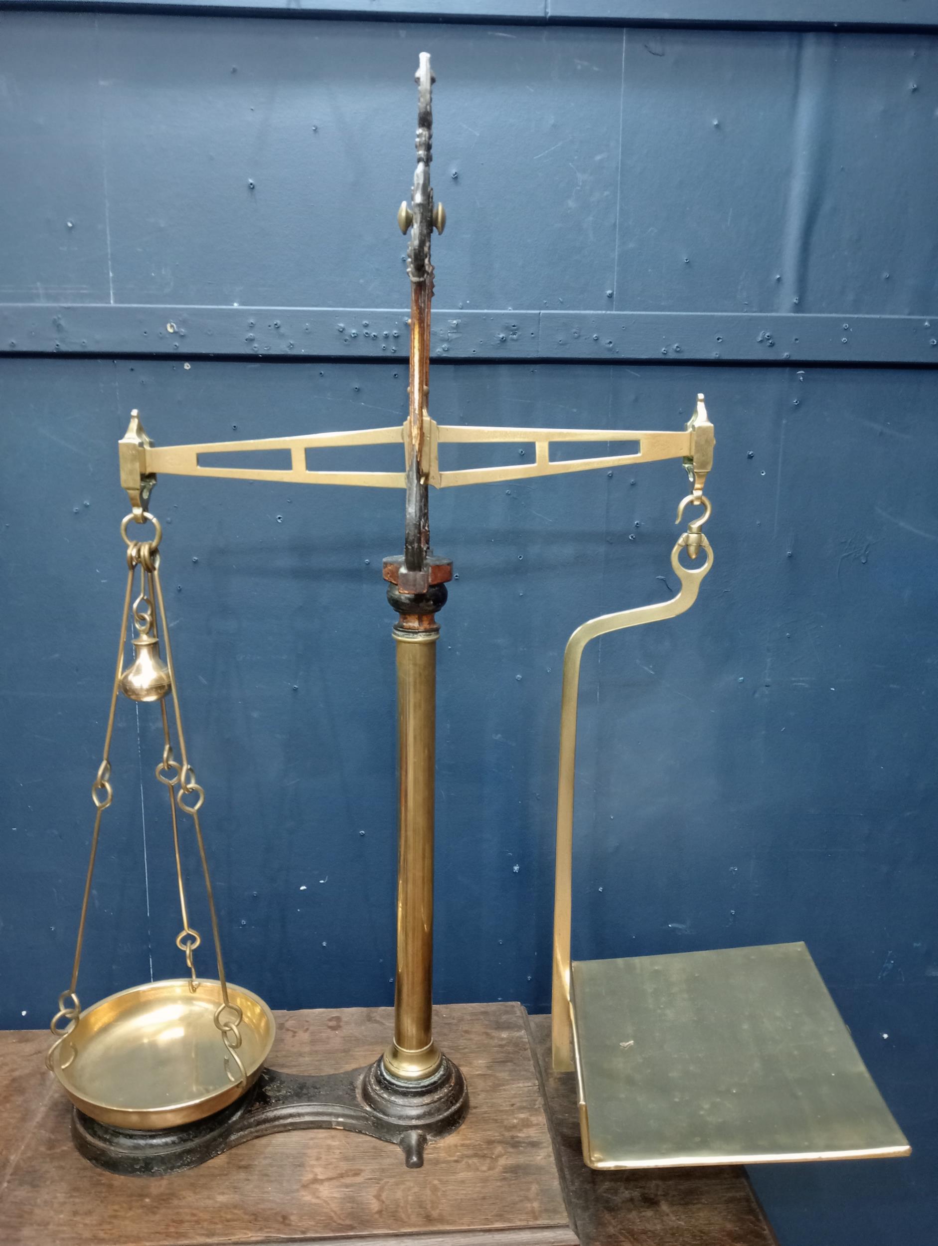 19th C. cast brass weighing scales {H 200cm x W 80cm x D 35cm }.