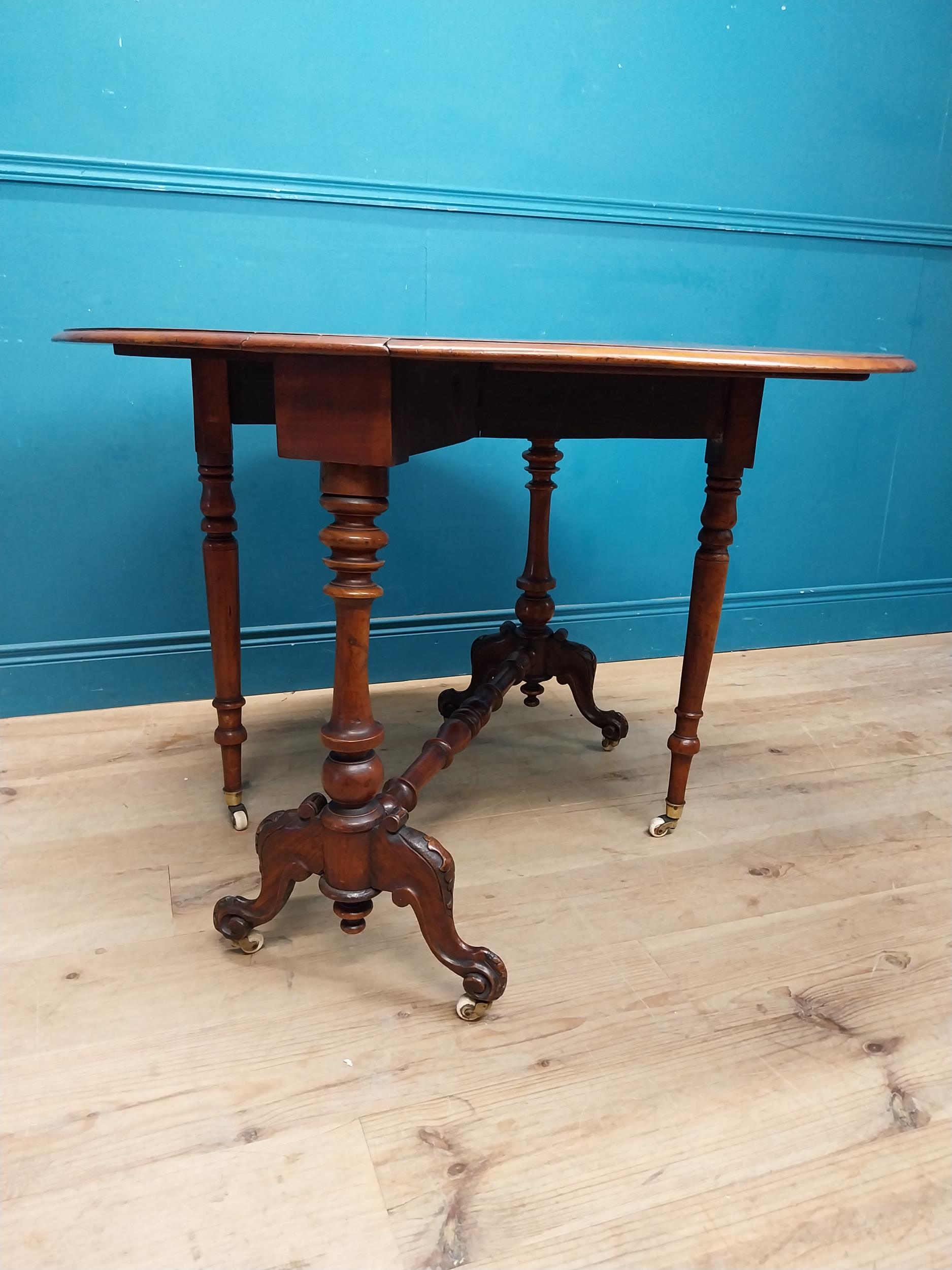 19th C. burr walnut Sutherland table with turned legs raised on arched feet with castors. {73 cm H x - Image 4 of 7